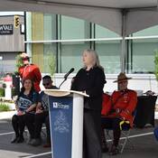 Public Safety Minister Nina Krieger at the podium giving a speech